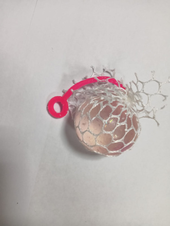 Игрушка-мялка антистресс белая сетка, прозрачный шарик с блестками и розовым хвостиком