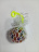 Мялка виноград антистресс белая сетка, прозрачный шарик, желтый хвостик, внутри разноцветные шарики